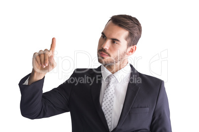 Thoughtful businessman pointing something with his finger