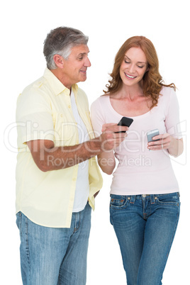 Casual couple sending text messages