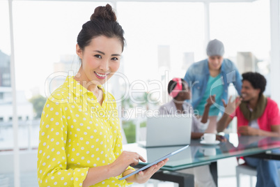 Young creative woman using her tablet