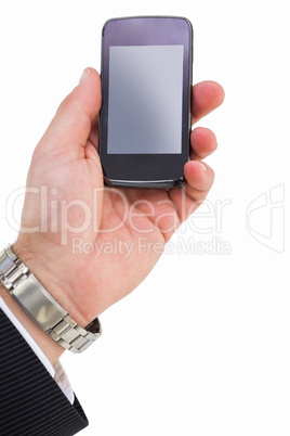 Hand with wrist watch holding mobile phone