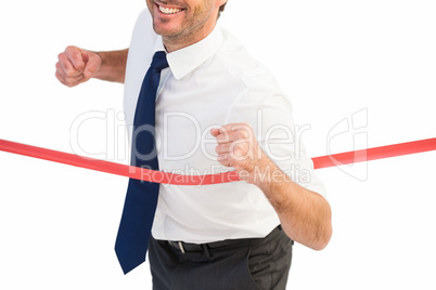 Businessman smiling and crossing the line