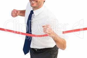 Businessman smiling and crossing the line