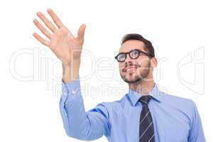 Smiling businessman standing with fingers spread out