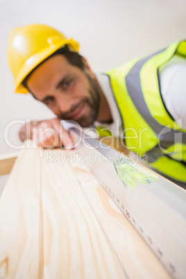 Construction worker using spirit level