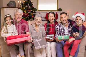 Happy extended family looking at camera at christmas time