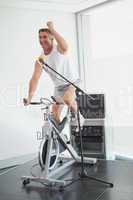 Spinning instructor motivating his class