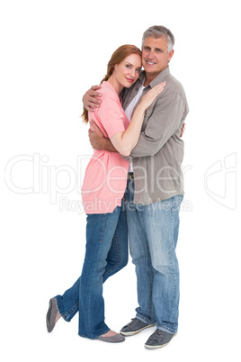 Casual couple hugging and smiling