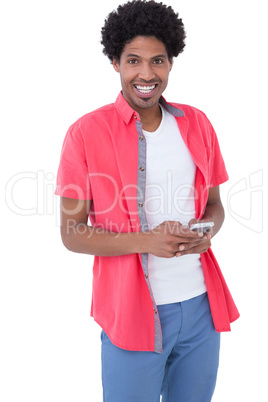 Happy causal man holding smartphone