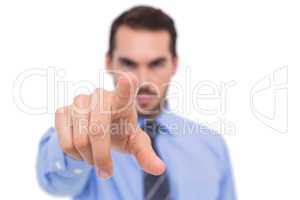 Businessman pointing his finger at camera