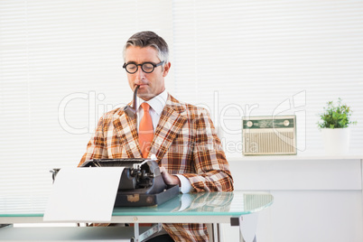 Retro man typing on typewriter