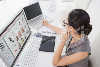 Photo editor working at her desk