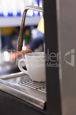 Cup of coffee on the espresso maker