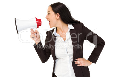 Pretty businesswoman shouting with megaphone