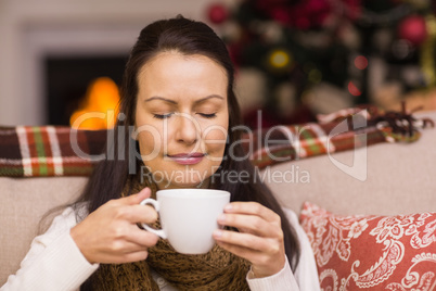 Pretty brunette enjoying hot chocolate