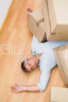 Man resting under his cardboard boxes