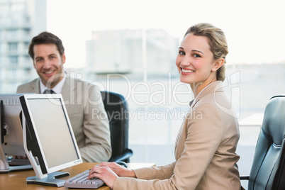 Two young business people using computer Two young business people using computer