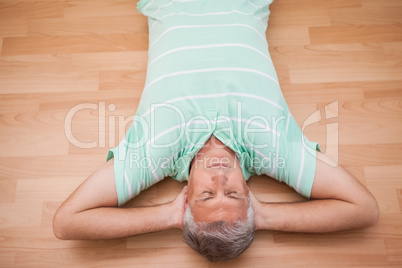 Mature man lying on floor