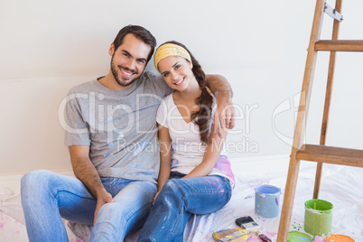 Cute couple about to paint living room