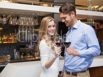 Lovely couple enjoying red wine