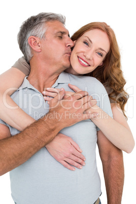 Casual couple hugging and smiling