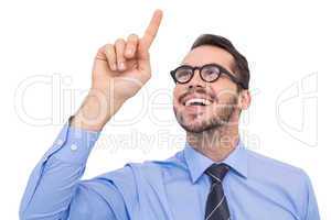 Happy businessman with glasses pointing