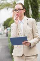 Young businesswoman using tablet pc