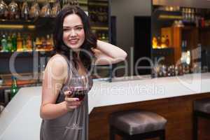 Pretty brunette enjoying red wine