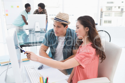 Young creative team working at desk