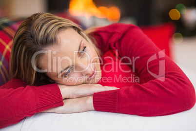 Relaxed blonde lying on the couch at christmas Relaxed blonde lying on the couch at christmas