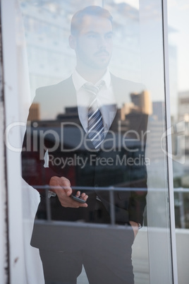 Businessman looking out the window