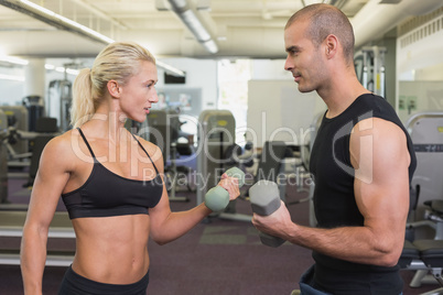 Strong couple lifting hand weights together