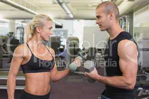 Strong couple lifting hand weights together