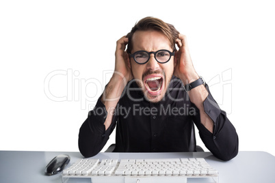 Businessman yelling with his hands on face