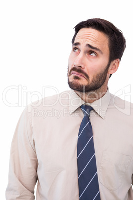 Portrait of a nervous businessman looking up Portrait of a nervous businessman looking up
