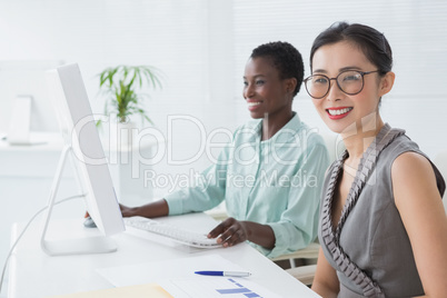 Businesswomen working together at desk