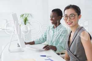 Businesswomen working together at desk