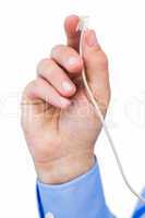 Hand of a businessman holding a white cable