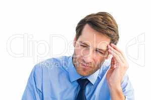Stressed businessman holding his head