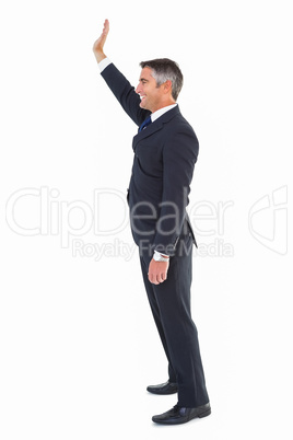 Happy businessman well dressed waving