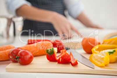 Woman following a recipe in book