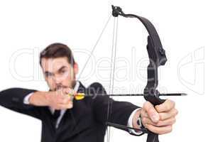 Close up of businessman shooting bow and arrow