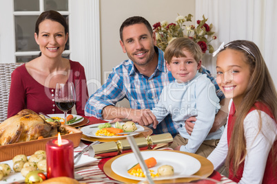 Portrait of smiling family during christmas dinner