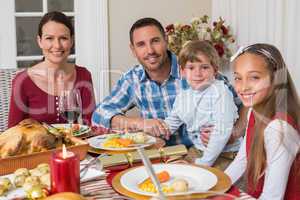 Portrait of smiling family during christmas dinner