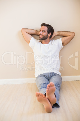 Happy man sitting on floor