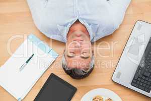 Man lying and sleeping on the floor