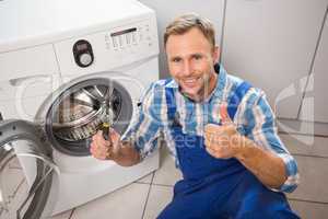 Handyman fixing a washing machine