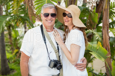 Holidaying couple smiling at camera