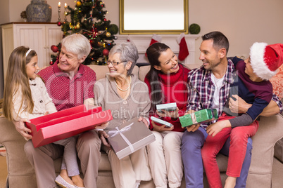 Festive family opening gifts at christmas