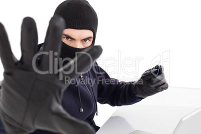Angry hacker using credit card and gesturing