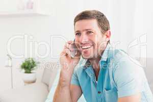 Smiling man on a phone
